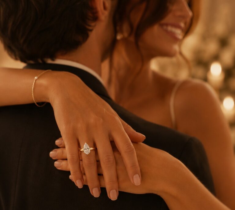 Bride embracing her partner wearing a pear-cut diamond engagement ring