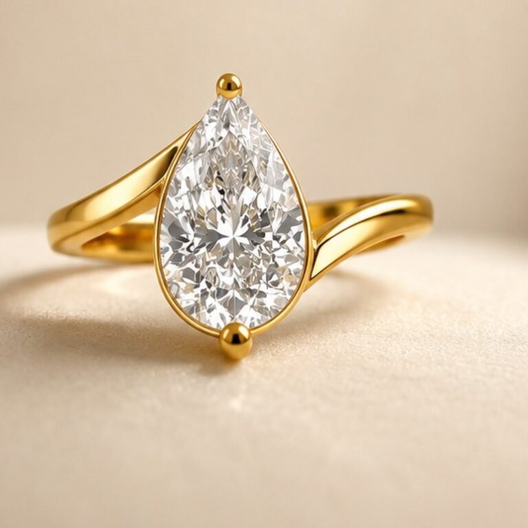 Pear-cut diamond solitaire ring in yellow gold