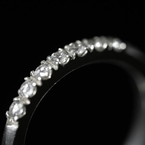 White gold eternity band set with round diamonds